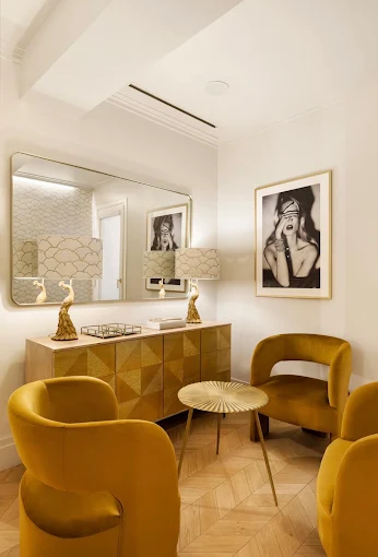 Bartorelli's mustard-velvet lounge with gold-framed mirror and vanity